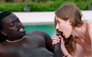 Tiffany Tatum at the pool blowing a fierce black cock